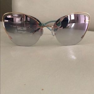 Silhouette sunglasses with rose gold wire cat-eye.